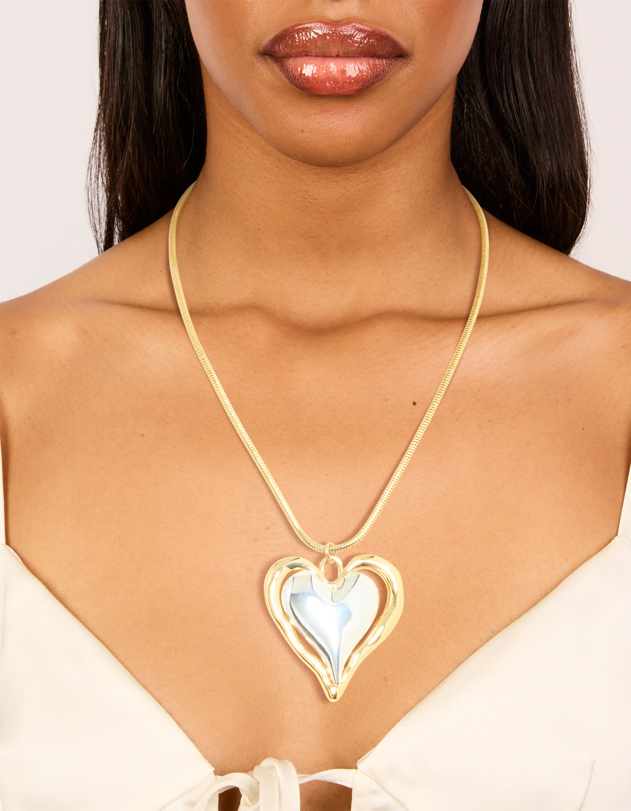1006-mixed-metal-plated-large-molten-heart-pendant-necklace-1.webp Mixed Metal Plated Large Molten Heart Pendant Necklace
