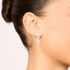 1050-silver-cubic-zirconia-huggie-earrings-1.webp Silver Cubic Zirconia Huggie Earrings