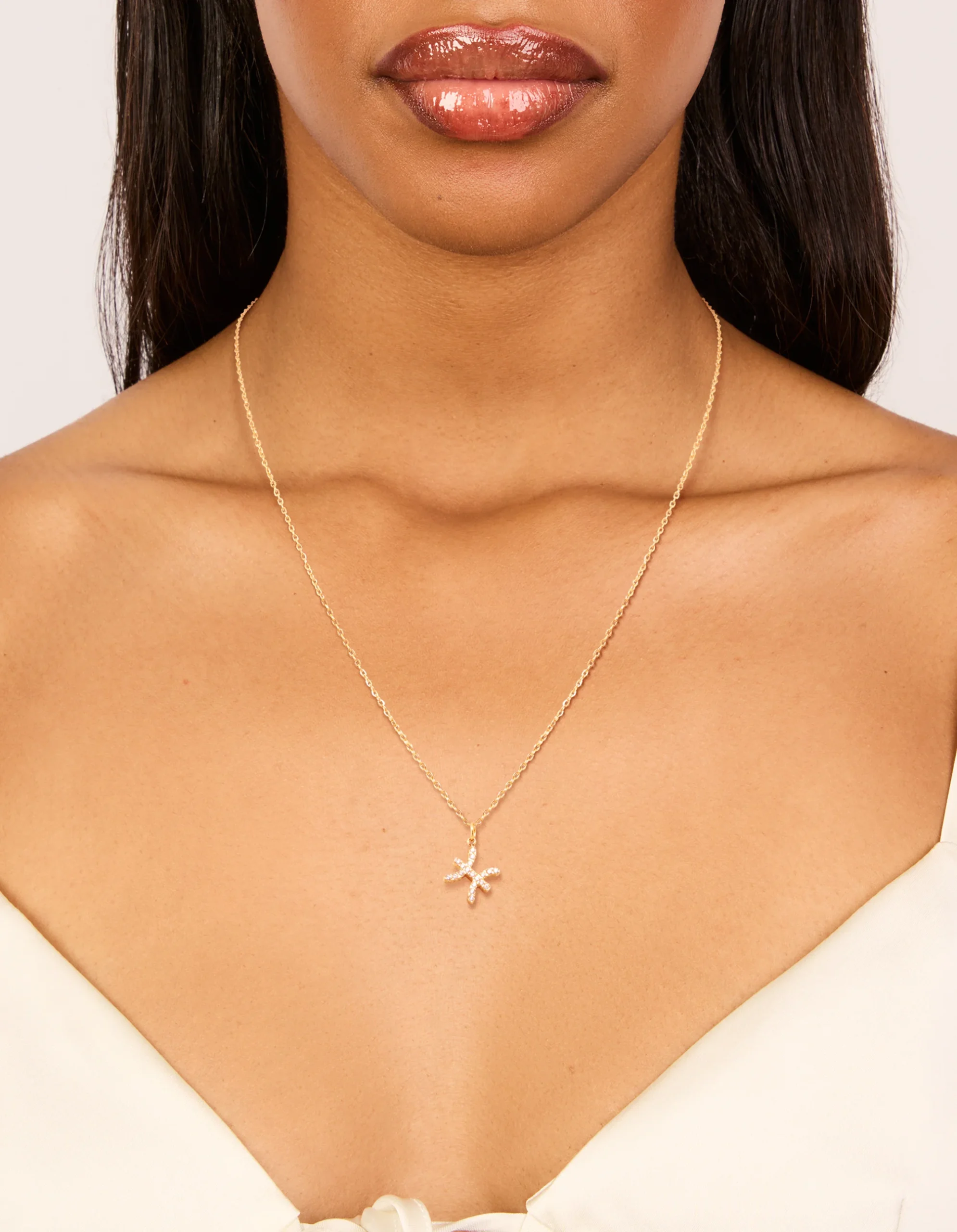 1143-waterproof-gold-plated-stainless-steel-cubic-zirconia-pisces-zodiac-sign-necklace-2.webp Waterproof Gold Plated Stainless Steel Cubic Zirconia Pisces Zodiac Sign Necklace