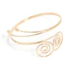 1286-gold-double-swirl-arm-cuff-1.webp Gold Double Swirl Arm Cuff
