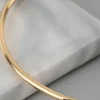 1499-18ct-gold-plated-brass-2mm-bangle-bracelet-3.webp 18ct Gold Plated Brass 2mm Bangle Bracelet