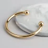1504-18ct-gold-plated-brass-ball-end-cuff-bracelet-1.webp 18ct Gold Plated Brass Ball End Cuff Bracelet