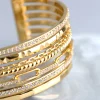 1509-18ct-gold-plated-brass-cubic-zirconia-multi-row-cuff-bracelet-2.webp 18ct Gold Plated Brass Cubic Zirconia Multi Row Cuff Bracelet
