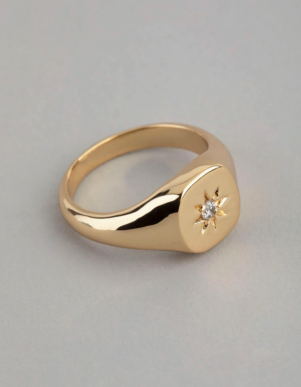 1513-18ct-gold-plated-brass-cubic-zirconia-star-signet-ring-1.webp 18ct Gold Plated Brass Cubic Zirconia Star Signet Ring