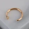 1627-9ct-gold-mini-nail-open-nose-ring-1.webp 9ct Gold Mini Nail Open Nose Ring