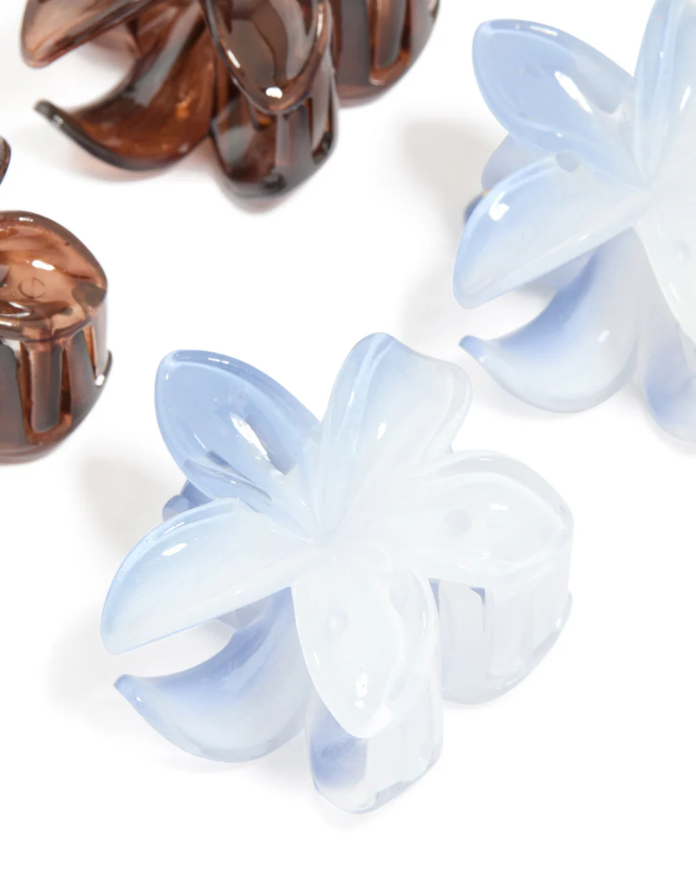 180-dark-brown-light-blue-frangipani-flower-claw-clips-4-pack-2.webp Dark Brown & Light Blue Frangipani Flower Claw Clips 4-Pack