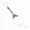 1909-antique-silver-black-stone-butterfly-hand-chain-1.webp Antique Silver Black Stone & Butterfly Hand Chain