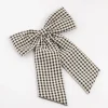 2089-black-white-gingham-fabric-medium-bow-clip-1.webp Black & White Gingham Fabric Medium Bow Clip