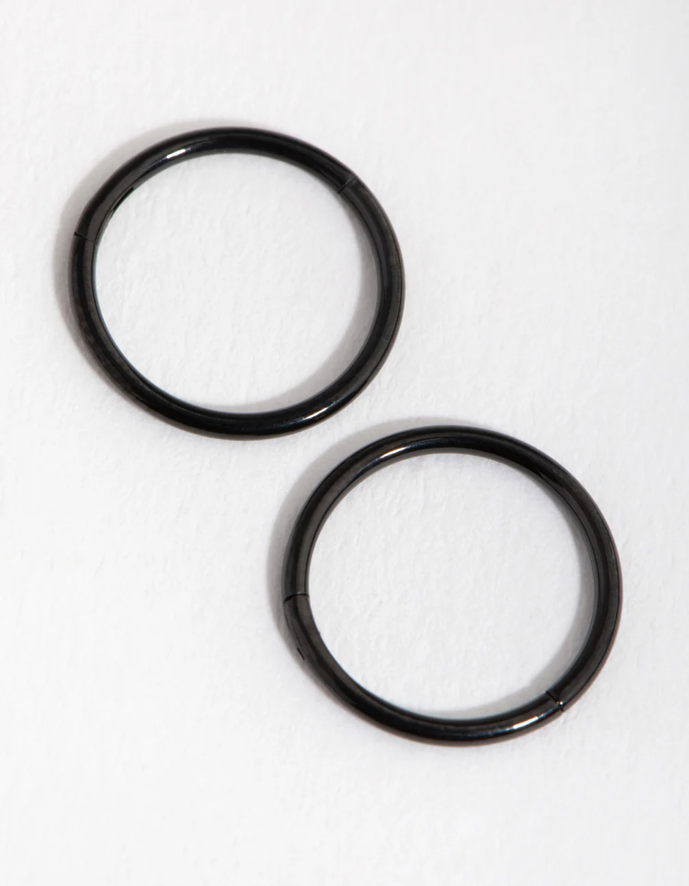 2182-black-coated-metal-surgical-steel-8mm-sleeper-earrings-1.webp Black Coated Metal Surgical Steel 8mm Sleeper Earrings