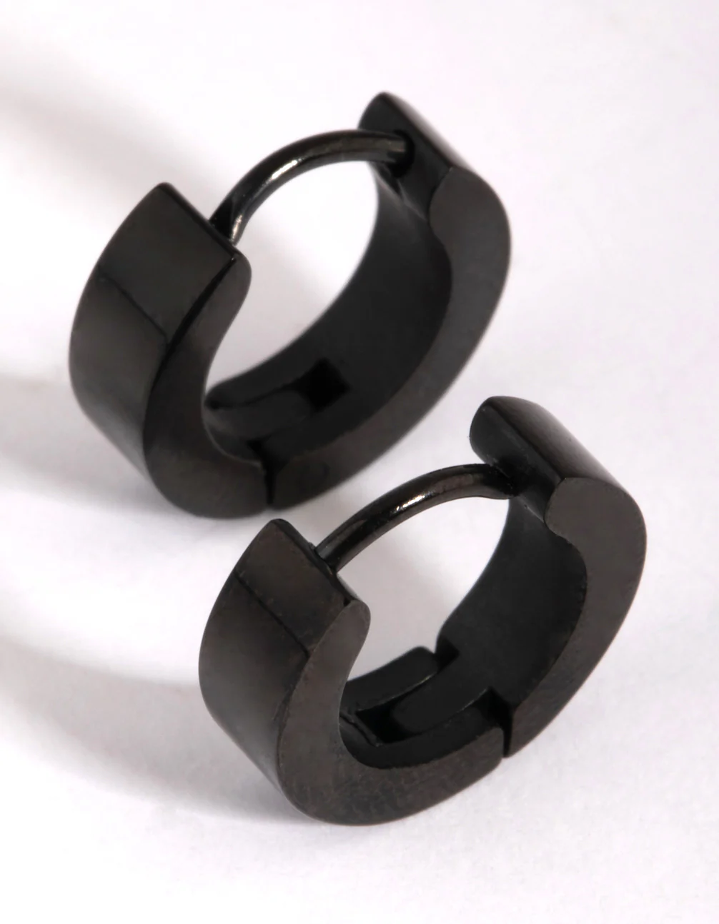 2200-black-coated-surgical-steel-wide-huggie-earrings-3.webp Black Coated Surgical Steel Wide Huggie Earrings