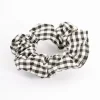 2297-black-fabric-checkered-scrunchie-1.webp Black Fabric Checkered Scrunchie