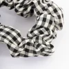 2297-black-fabric-checkered-scrunchie-2.webp Black Fabric Checkered Scrunchie
