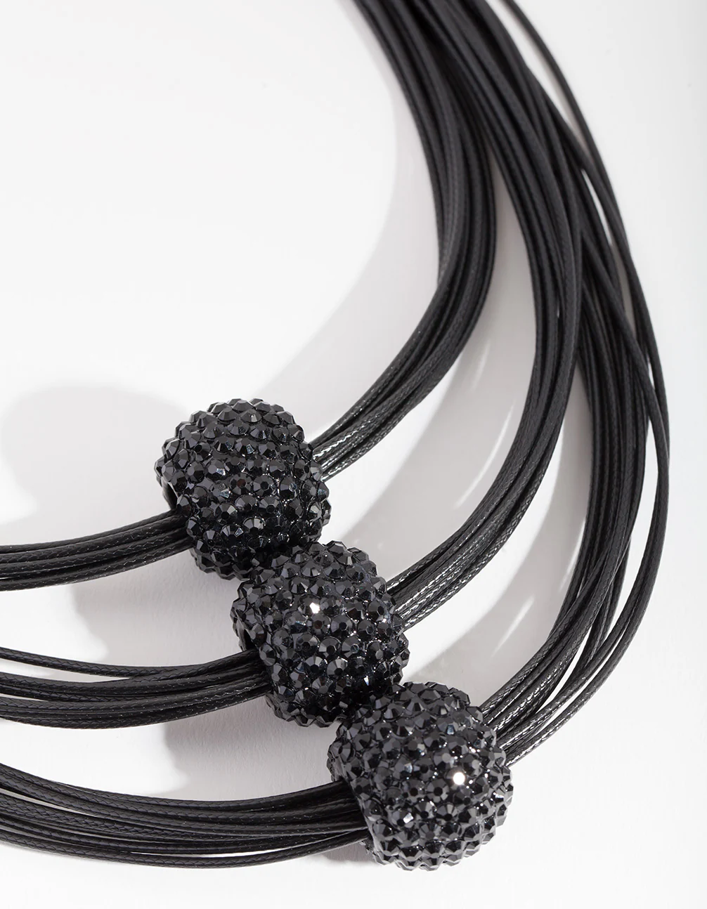 2526-black-triple-row-bead-necklace-1.webp Black Triple Row Bead Necklace