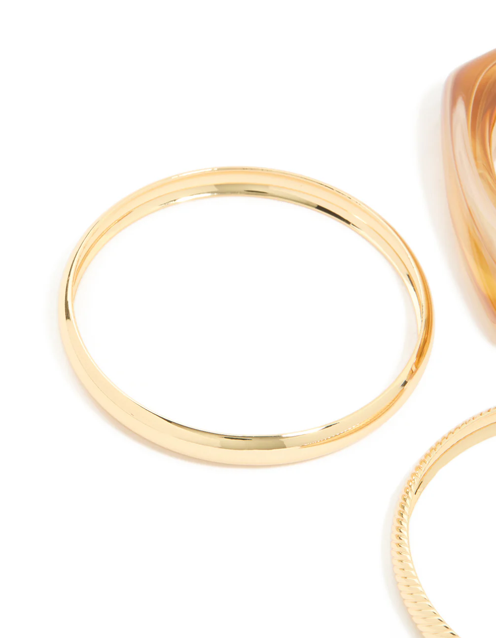 2757-brown-acrylic-gold-bangles-3-pack-2.webp Brown Acrylic & Gold Bangles 3-Pack