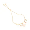 289-gold-pink-flowers-charm-toggle-bangle-2.webp Gold Pink Flowers Charm Toggle Bangle