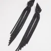 2898-coated-black-statement-strand-twist-drop-earrings-1.webp Coated Black Statement Strand Twist Drop Earrings