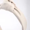 2976-cream-fabric-faux-leather-large-knot-headband-2.webp Cream Fabric Faux Leather Large Knot Headband