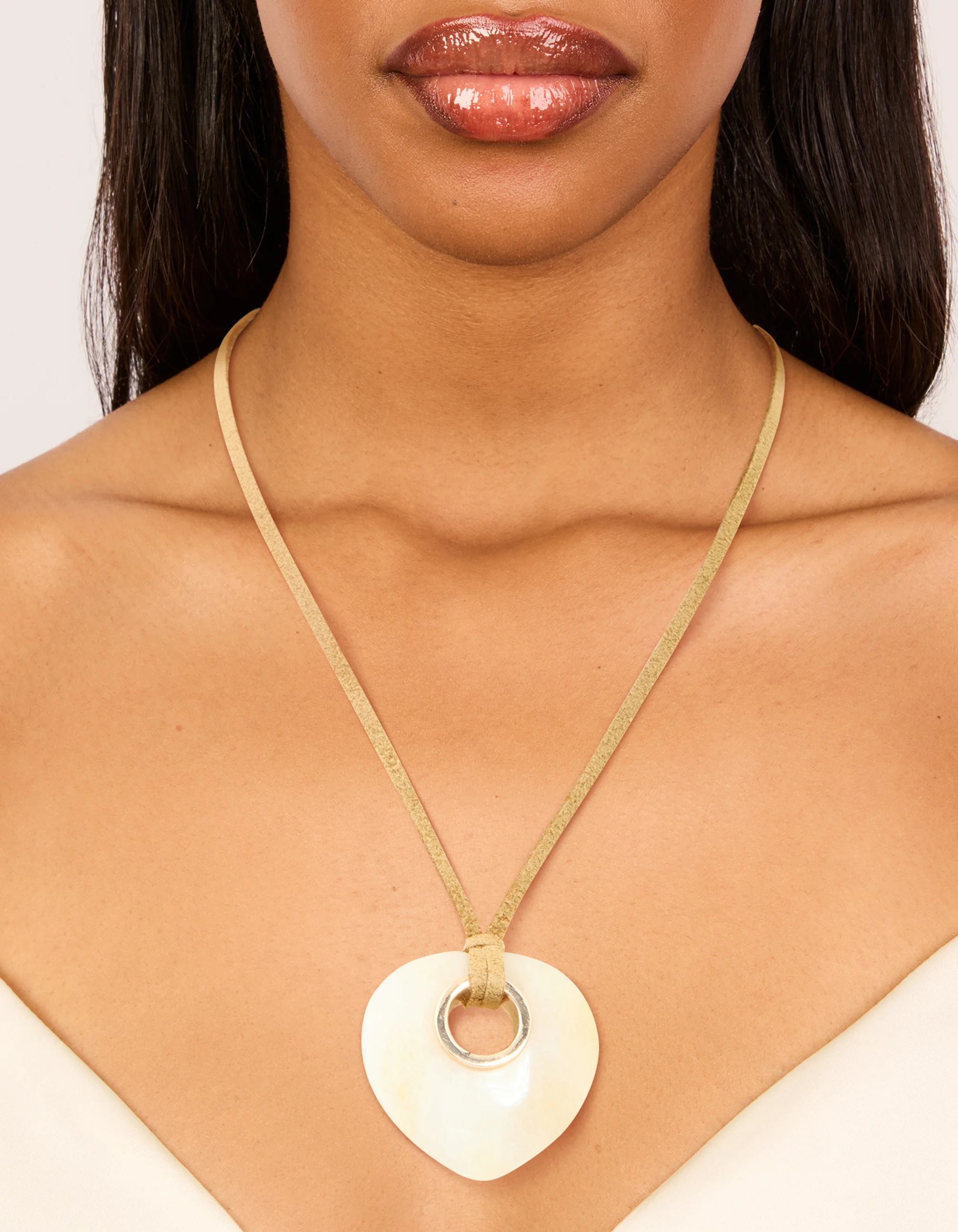 2999-cream-stone-pendant-brown-cord-necklace-2.webp Cream Stone Pendant Brown Cord Necklace