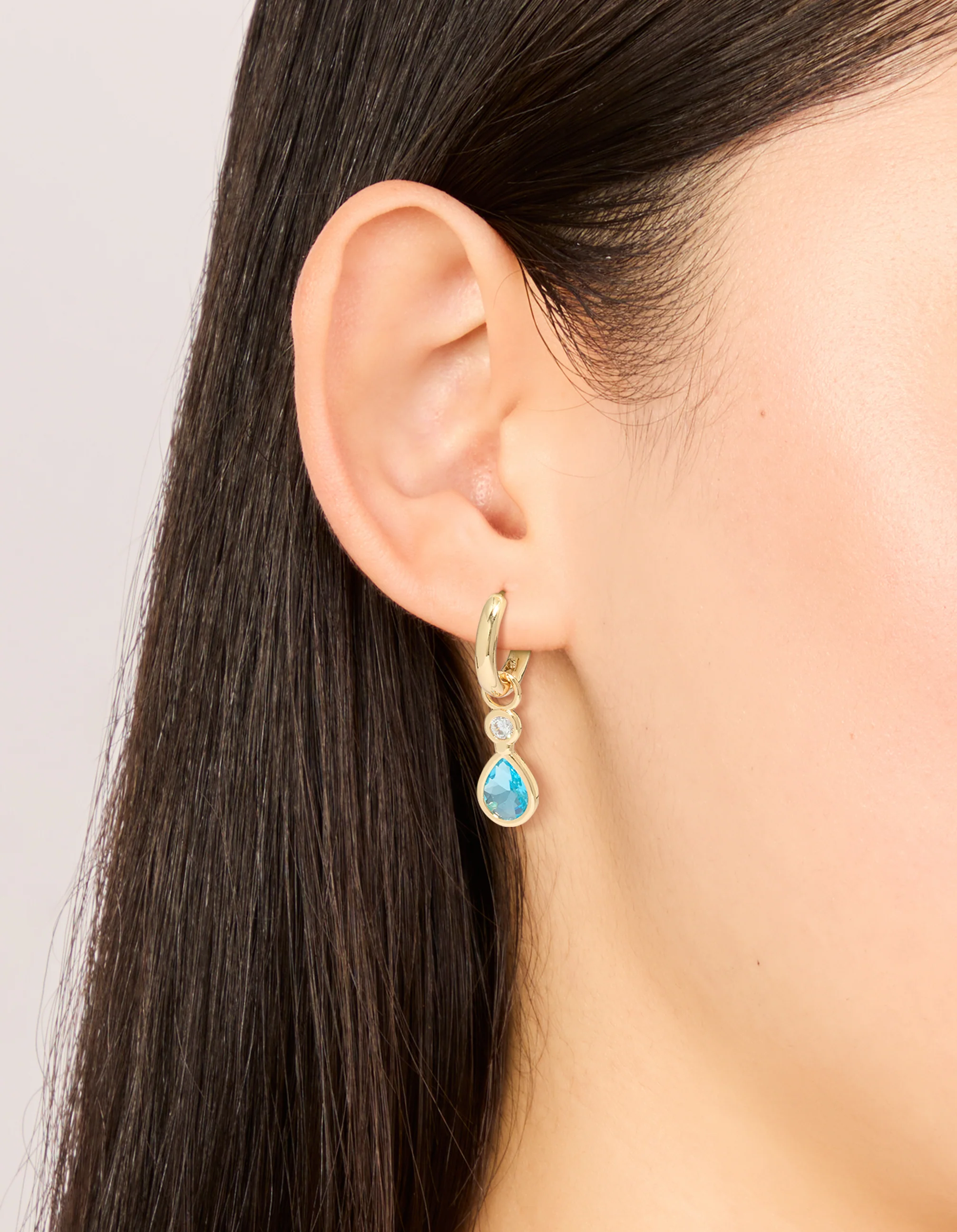 306-gold-plated-blue-cubic-zirconia-teardrop-huggie-earrings-1.webp Gold Plated Blue Cubic Zirconia Teardrop Huggie Earrings