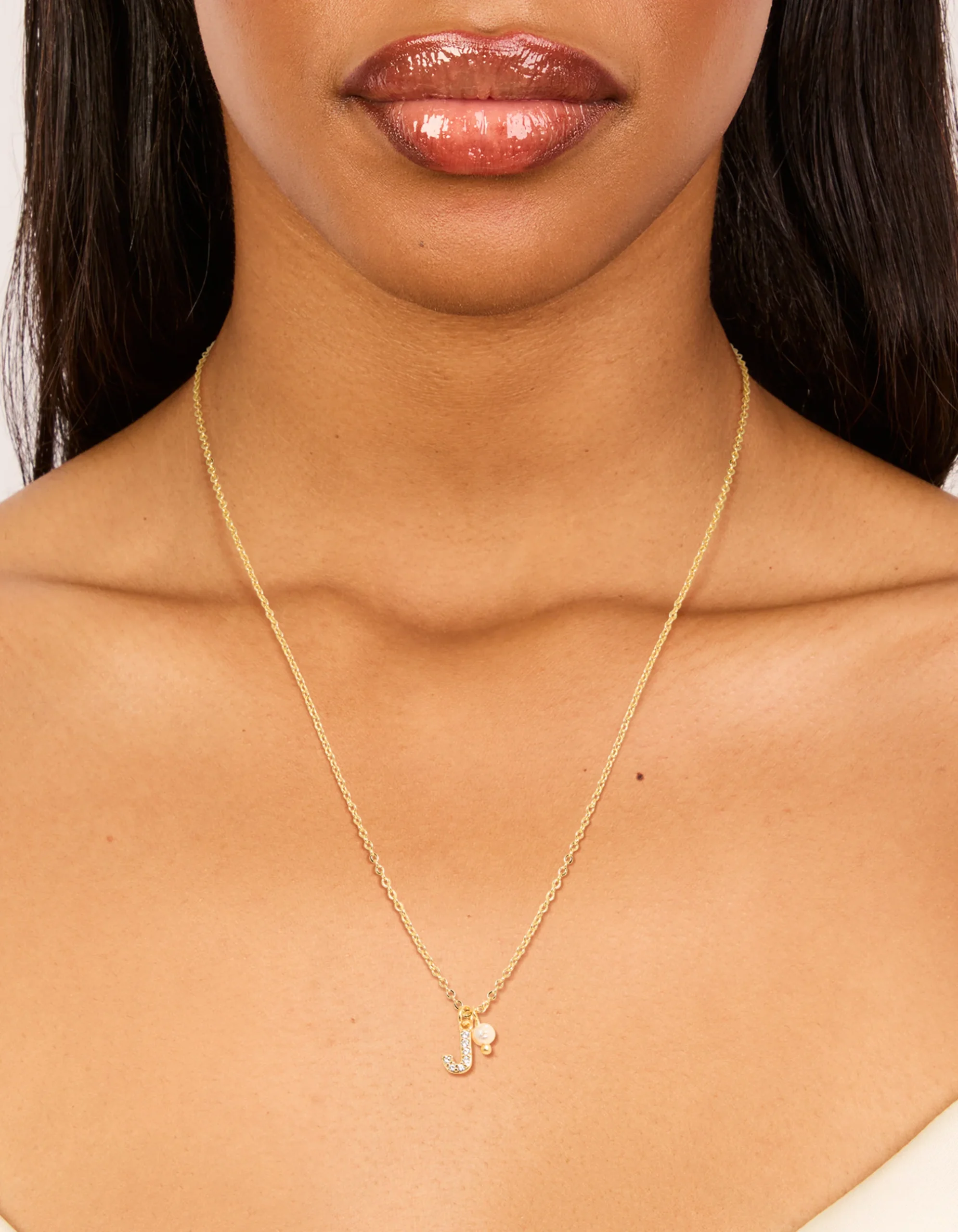 327-gold-plated-cubic-zirconia-pearl-letter-j-necklace-1.webp Gold Plated Cubic Zirconia & Pearl Letter J Necklace