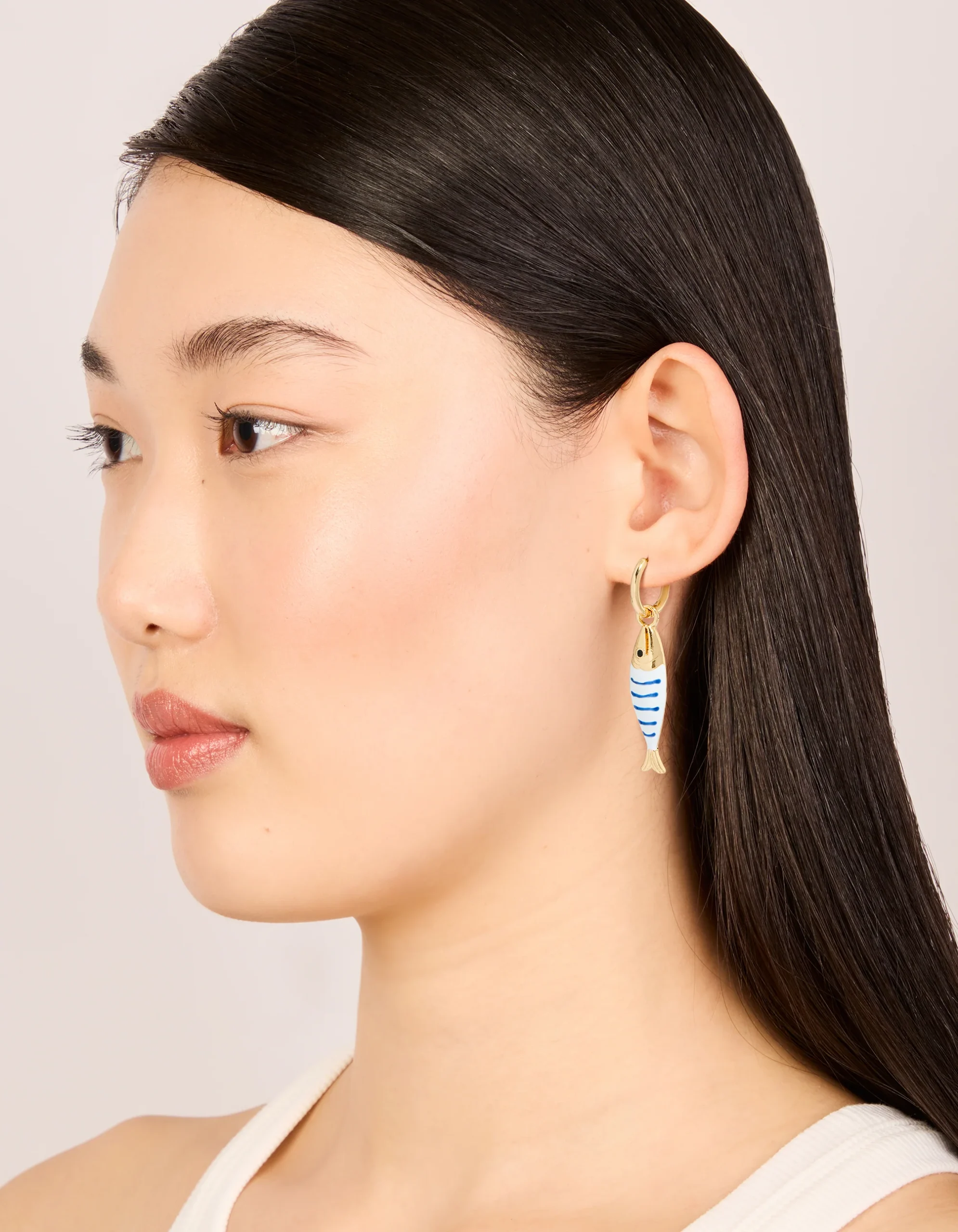 38-gold-white-blue-striped-fish-huggie-earrings-3.webp Gold White & Blue Striped Fish Huggie Earrings