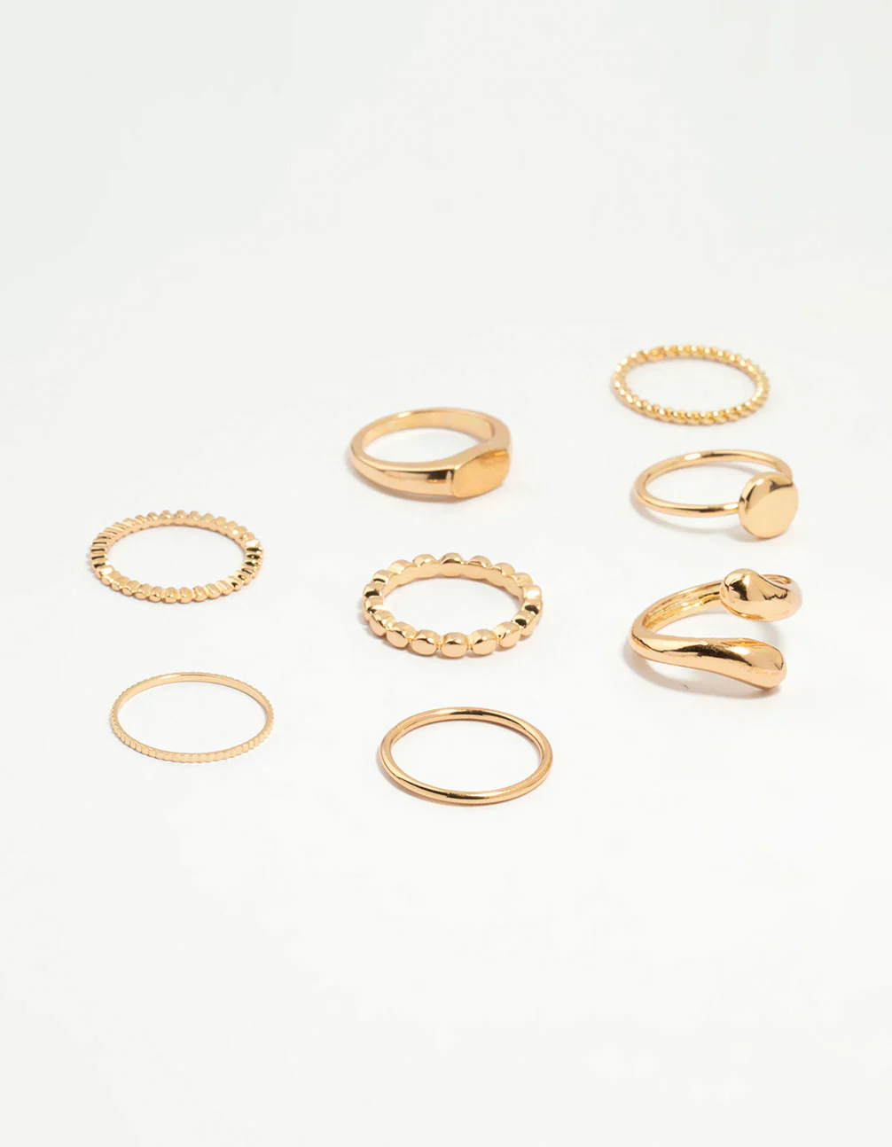 516-gold-thin-wrap-circle-stacking-rings-8-pack-1.webp Gold Thin Wrap Circle Stacking Rings 8-Pack