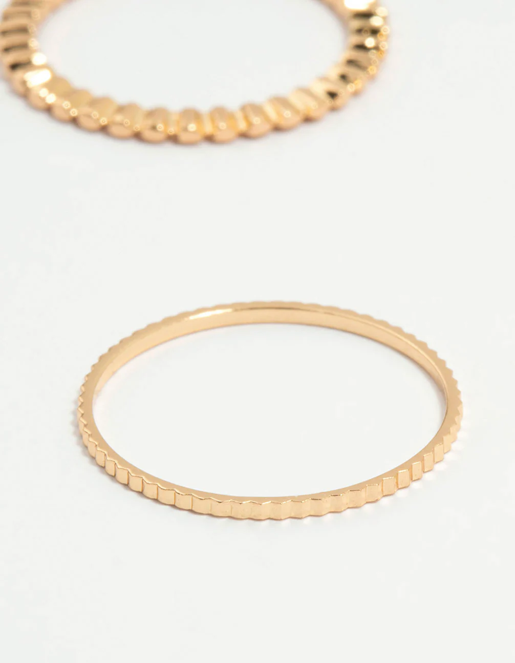516-gold-thin-wrap-circle-stacking-rings-8-pack-2.webp Gold Thin Wrap Circle Stacking Rings 8-Pack
