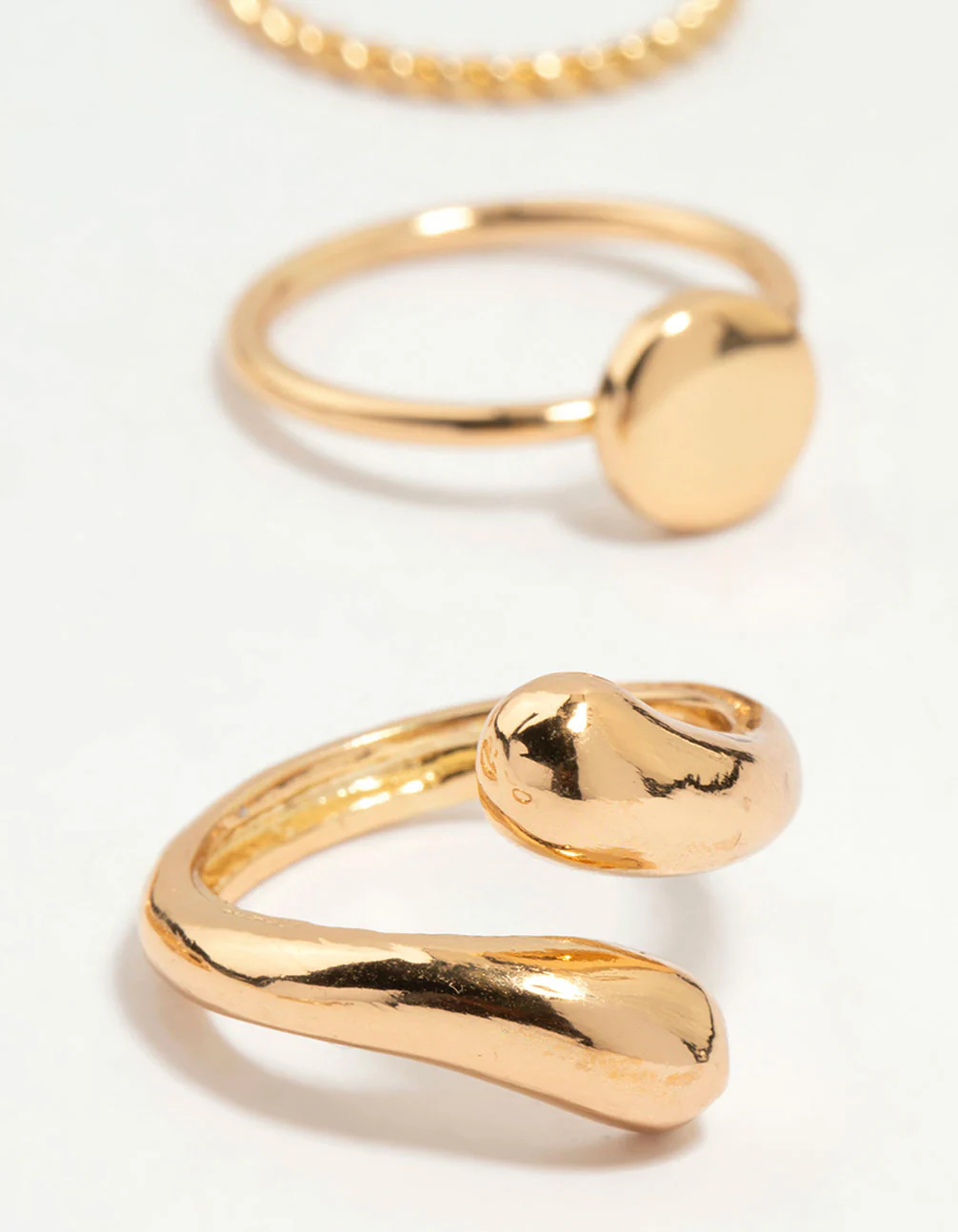 516-gold-thin-wrap-circle-stacking-rings-8-pack-3.webp Gold Thin Wrap Circle Stacking Rings 8-Pack