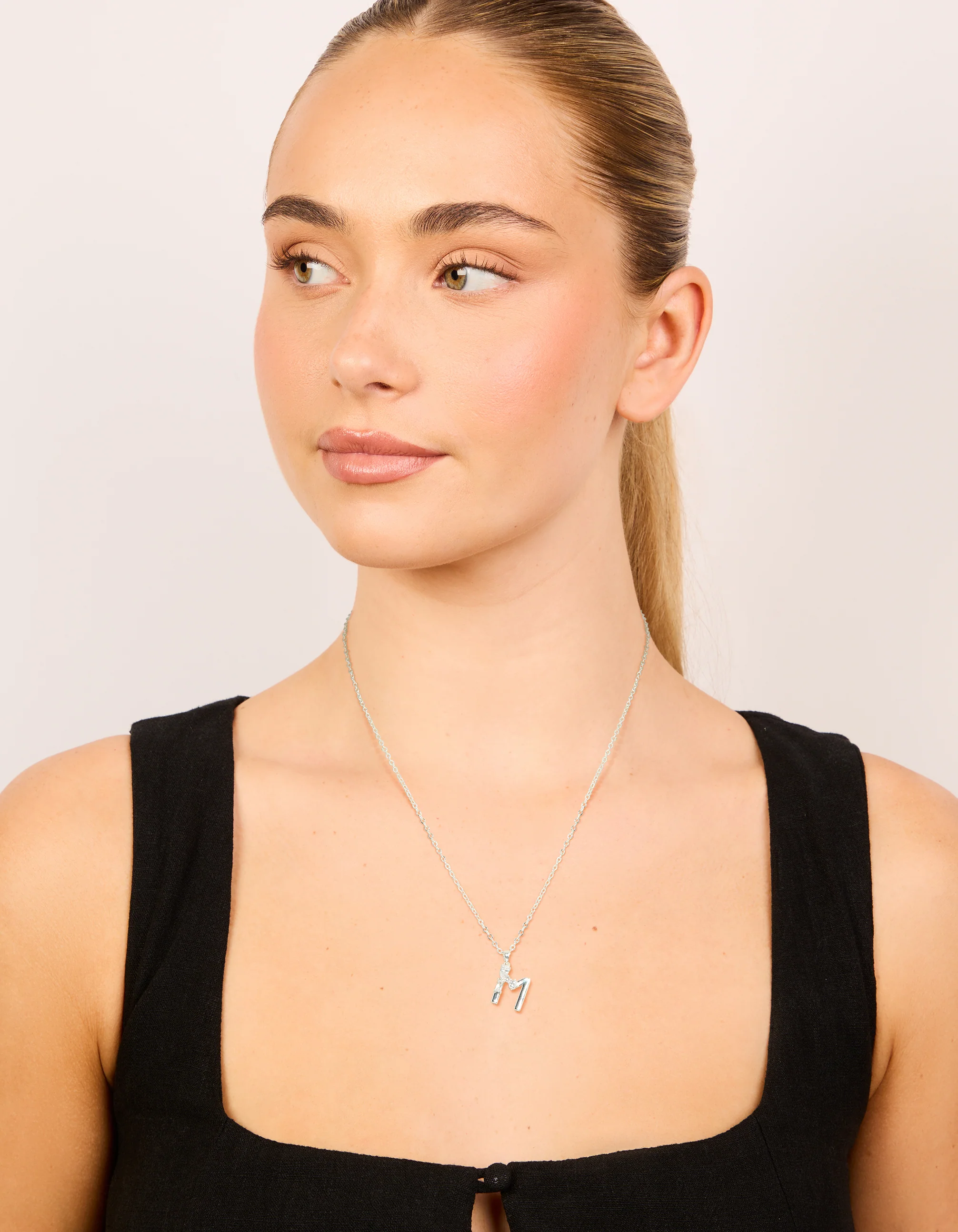 665-silver-plated-thin-cubic-zirconia-letter-m-necklace-3.webp Silver Plated Thin Cubic Zirconia Letter M Necklace