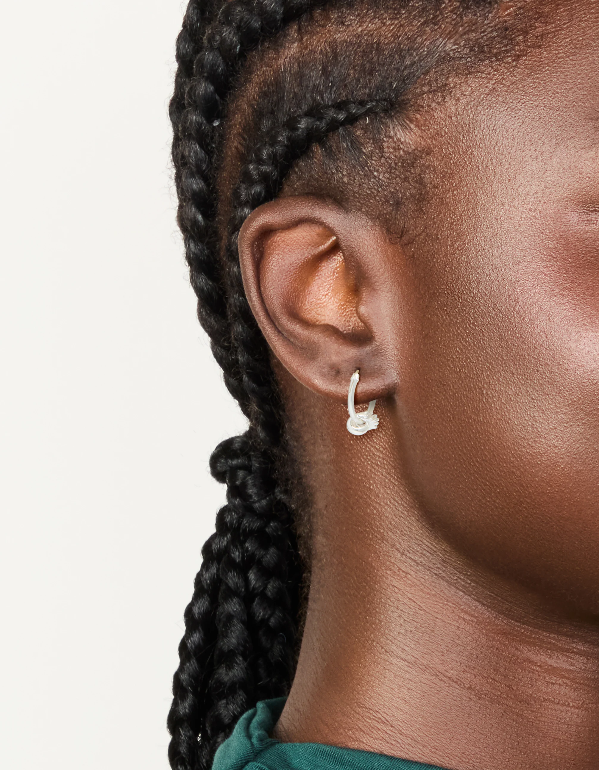 685-sterling-silver-cubic-zirconia-knotted-hoop-earrings-1.webp Sterling Silver Cubic Zirconia Knotted Hoop Earrings