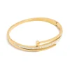728-waterproof-gold-plated-stainless-steel-cubic-zirconia-nail-hinge-bangle-1.webp Waterproof Gold Plated Stainless Steel Cubic Zirconia Nail Hinge Bangle
