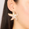 814-gold-white-acrylic-starfish-medallion-earrings-1.webp Gold White Acrylic Starfish Medallion Earrings
